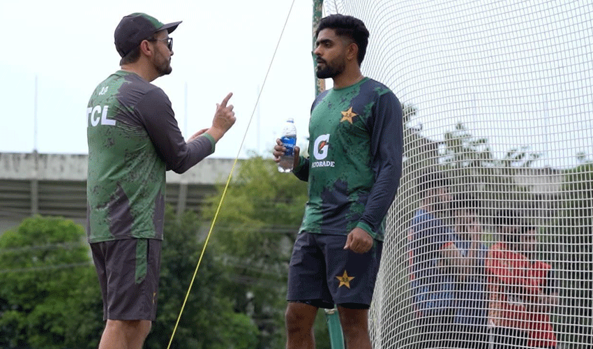Mike Hesson with Babar Azam