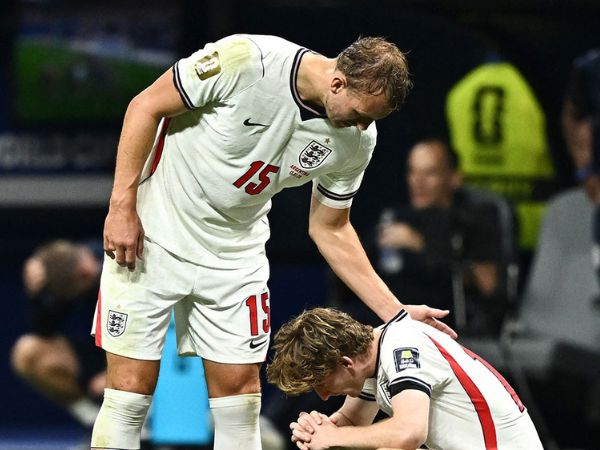 England's Anthony Gordon and Dan Burn look dejected after the semifinal match