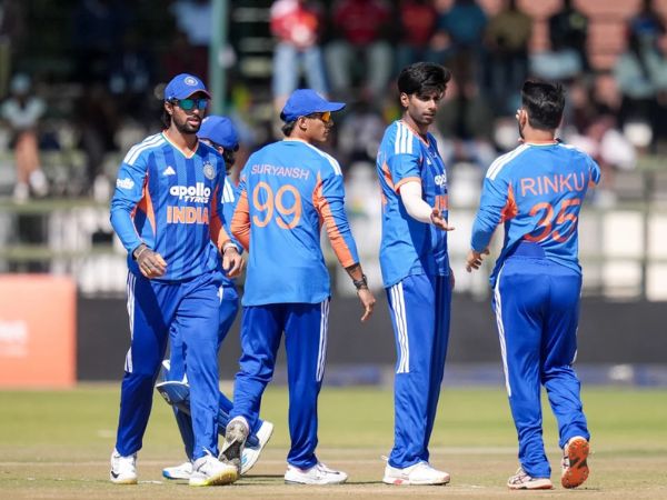 Indian players celebrate after taking a wicket against Zimbabwe at Harare