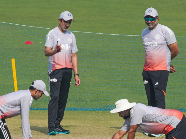 Indian coaching staff assess the ground