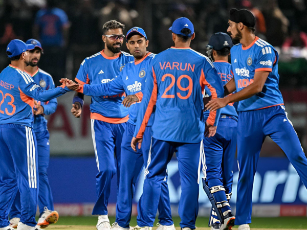 The Indian team celebrates after taking a wicket